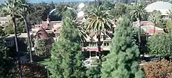 A view of the house from a highrise building to the south