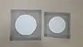 6-inch (150&nbsp;mm, left) and 5-inch (125&nbsp;mm, right) wire gauze squares