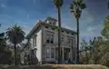 Photograph of the Victorian John Muir House from street level, looking up at the house and its pergola against the sky.