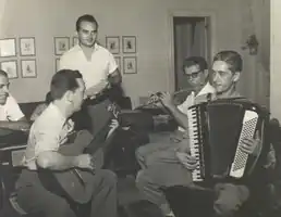 Trio Surdina members Garoto and Chiquinho do Acordeon alongside Radamés Gnatalli and Billy Blanco
