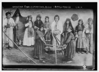 A Mawana Assyrian family making dairy product using sheepskin.